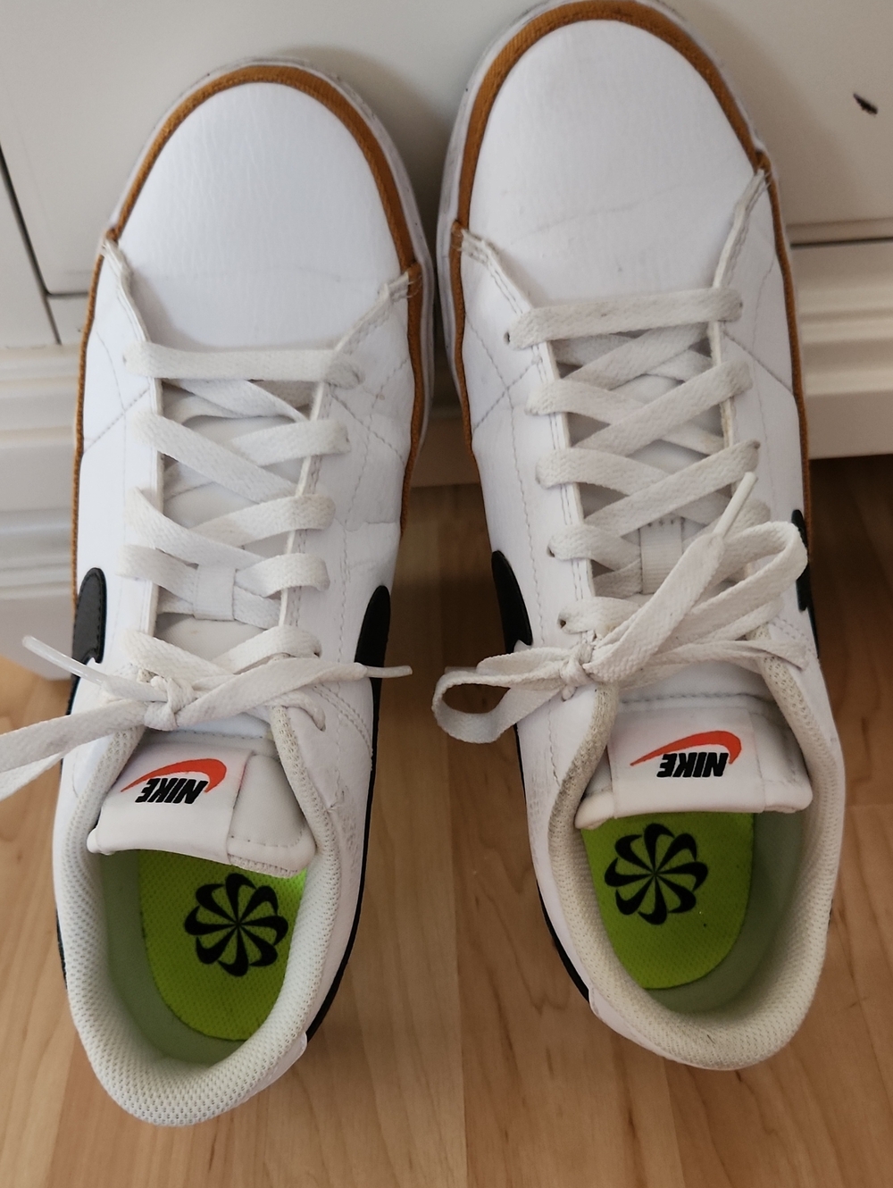 Nike White Leather Sneakers with Black Swoosh and Gum Trim